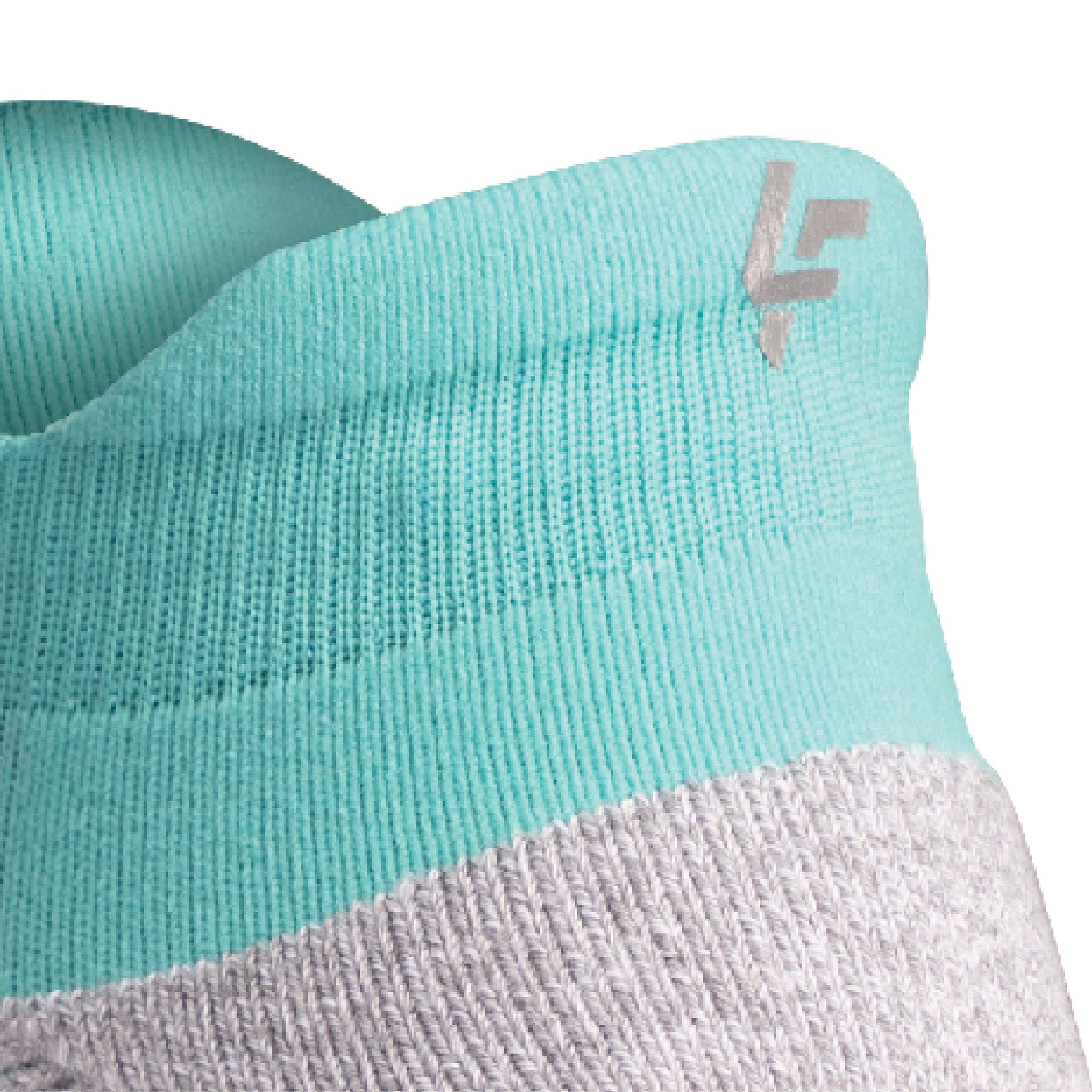 Close up view of reflective symbol on Lightfeet Performance Mint Ankle Sock