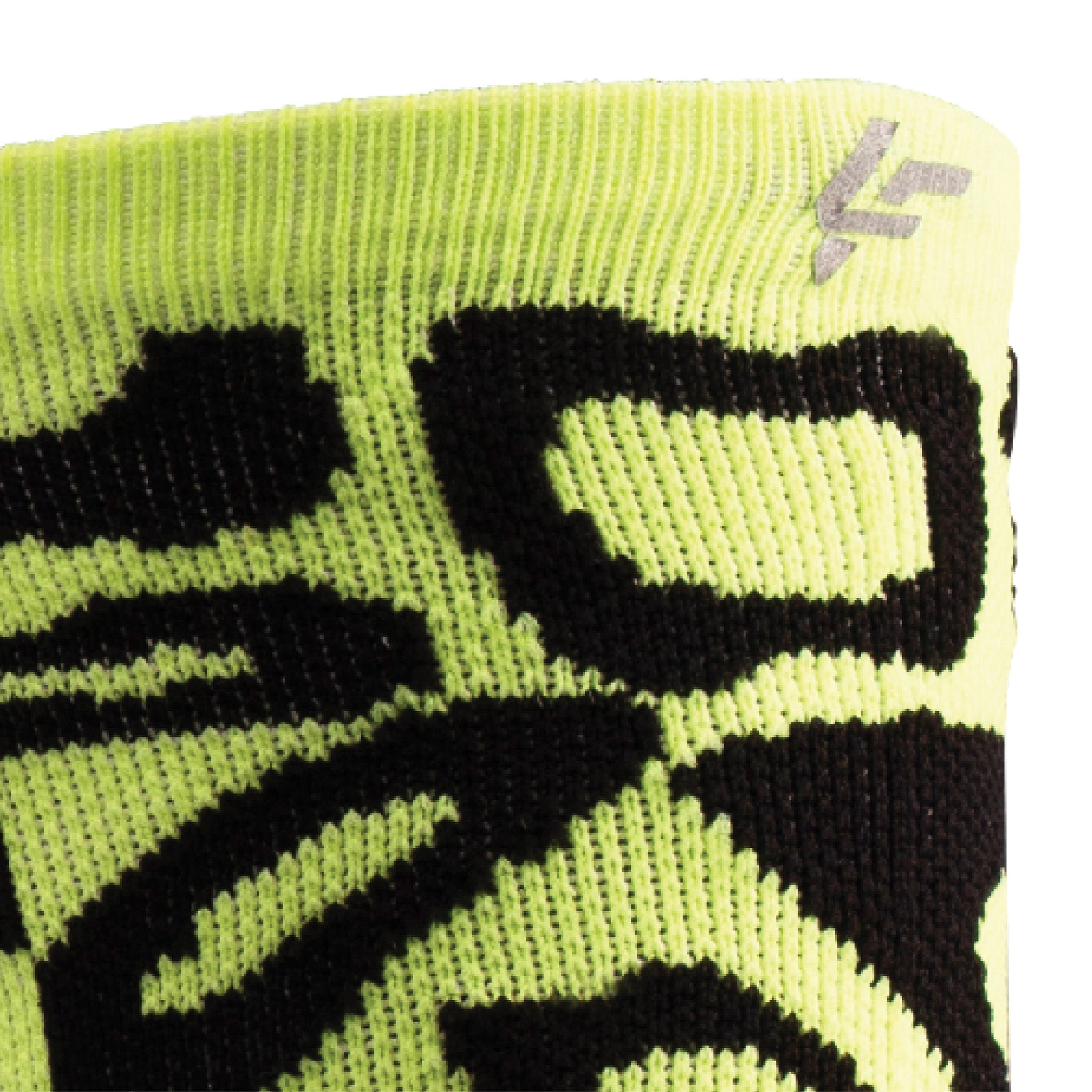 Close up view of reflective print symbol on Lightfeet Performance Scribbles Yellow Black Crew Socks