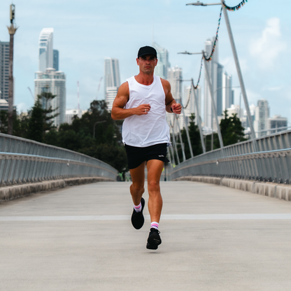 Image of person wearing Lightfeet Performance 2 Stripes White Pink Purple Quarter Socks 