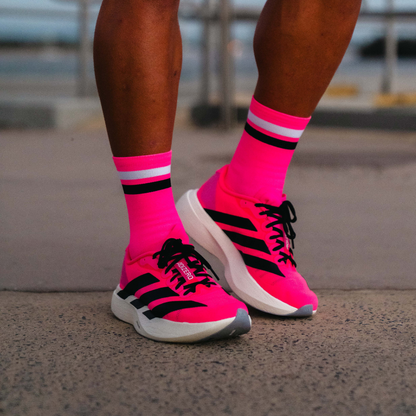 Image of person wearing Lightfeet Performance 2 Stripes Pink White Black_x0010_Crew Socks 