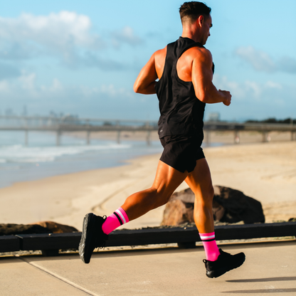 Image of person wearing Lightfeet Performance 2 Stripes Pink White Black_x0010_Crew Socks 