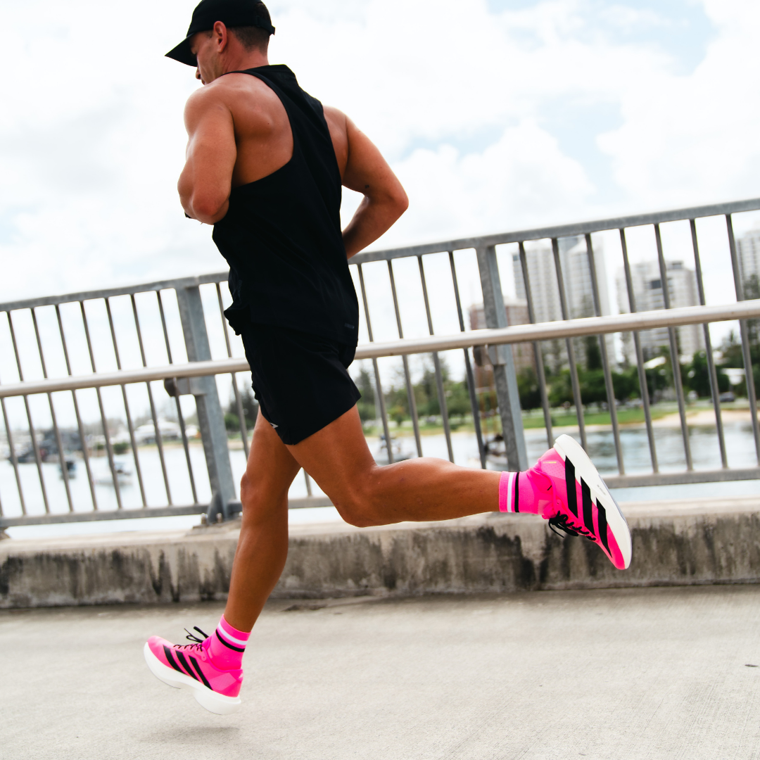 Image of person wearing Lightfeet Performance 2 Stripes Pink White Black_x0010_Quarter Socks 