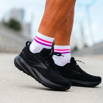 Image of person wearing Lightfeet Performance 2 Stripes White Pink Purple Quarter Socks 