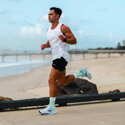 Image of person wearing Lightfeet Performance 2 Stripes Glacier Yellow White Crew Socks 