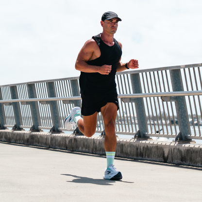 Image of person wearing Lightfeet Performance 2 Stripes Glacier Yellow White Crew Socks 