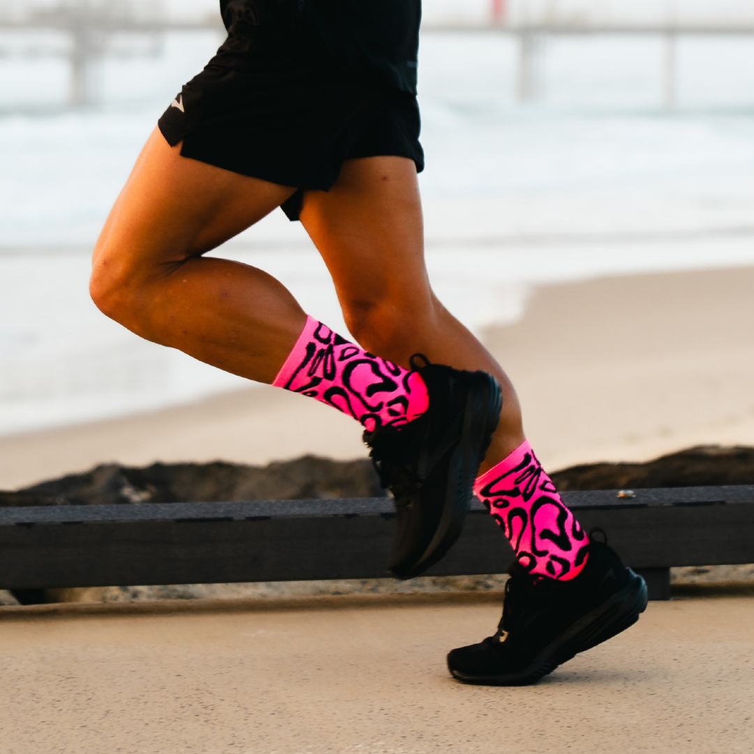 Image of person wearing Lightfeet Performance Scribbles Pink Black Crew Socks 