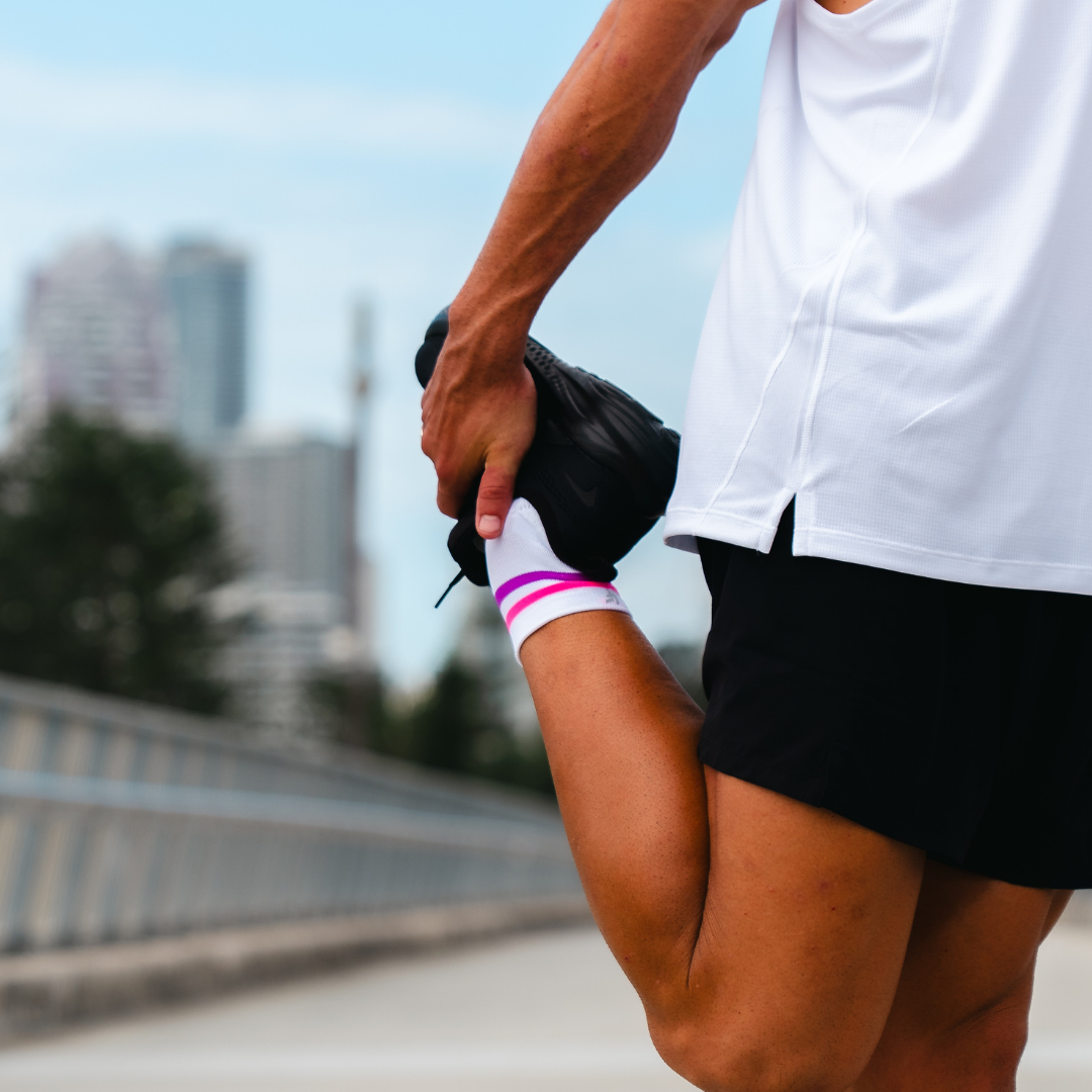 Image of person wearing Lightfeet Performance 2 Stripes White Pink Purple Quarter Socks 