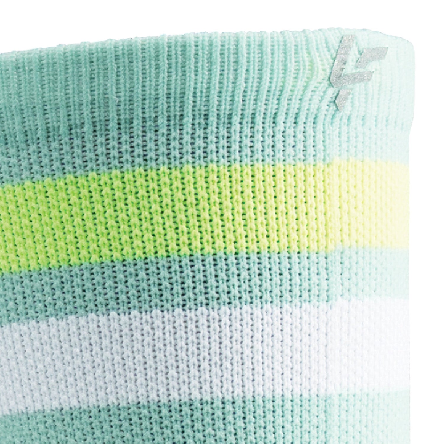 Close up view of reflective print symbol on Lightfeet Performance 2 Stripes Glacier Yellow White Crew Socks 