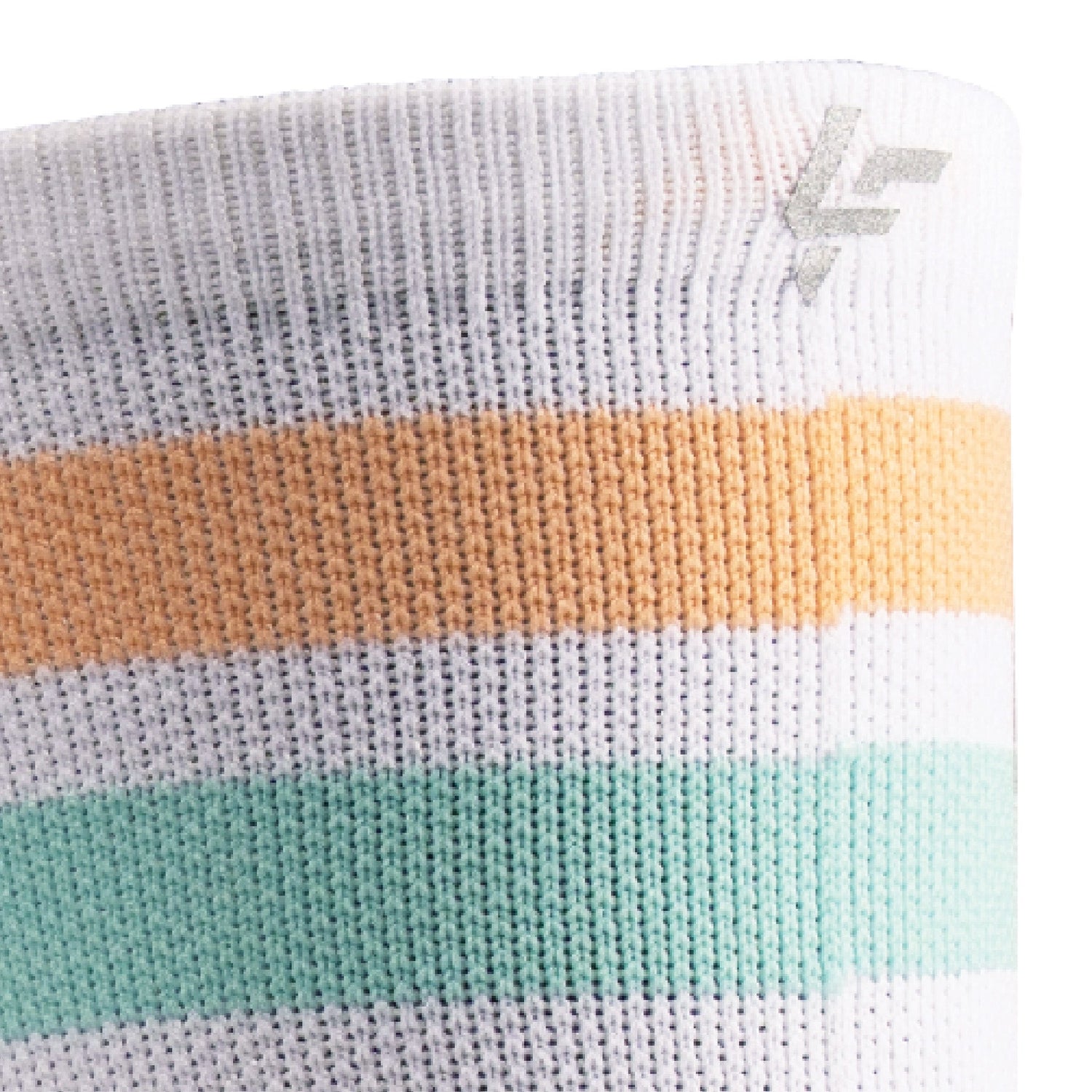 Close up view of reflective print symbol on Lightfeet Performance 2 Stripes White Coral Glacier Crew Socks 