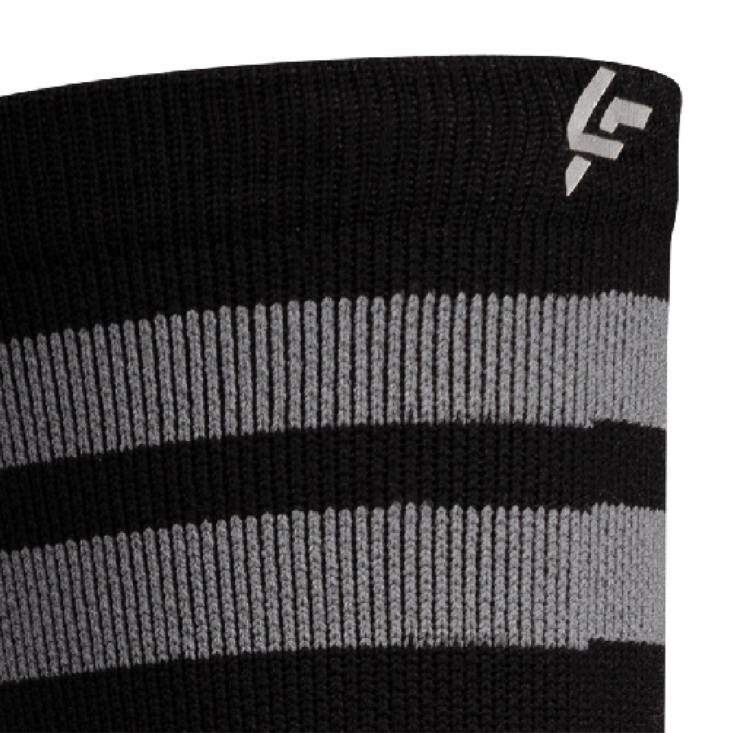 Close up view of reflective print symbol on Lightfeet Performance 2 Stripes Black Half Crew Sock 