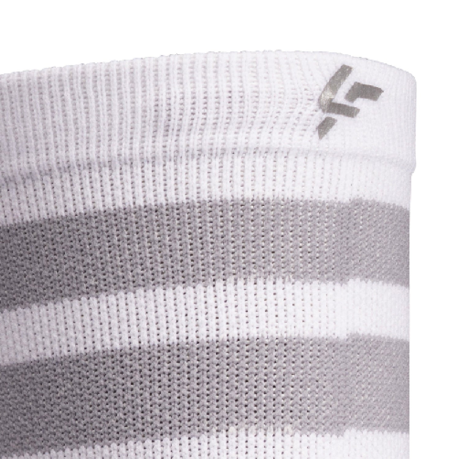 Close up view of reflective print symbol on Lightfeet Performance 2 Stripes White Half Crew Sock 