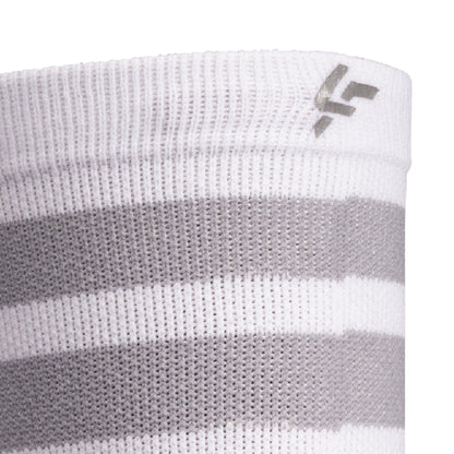 Close up view of reflective print symbol on Lightfeet Performance 2 Stripes White Half Crew Sock 