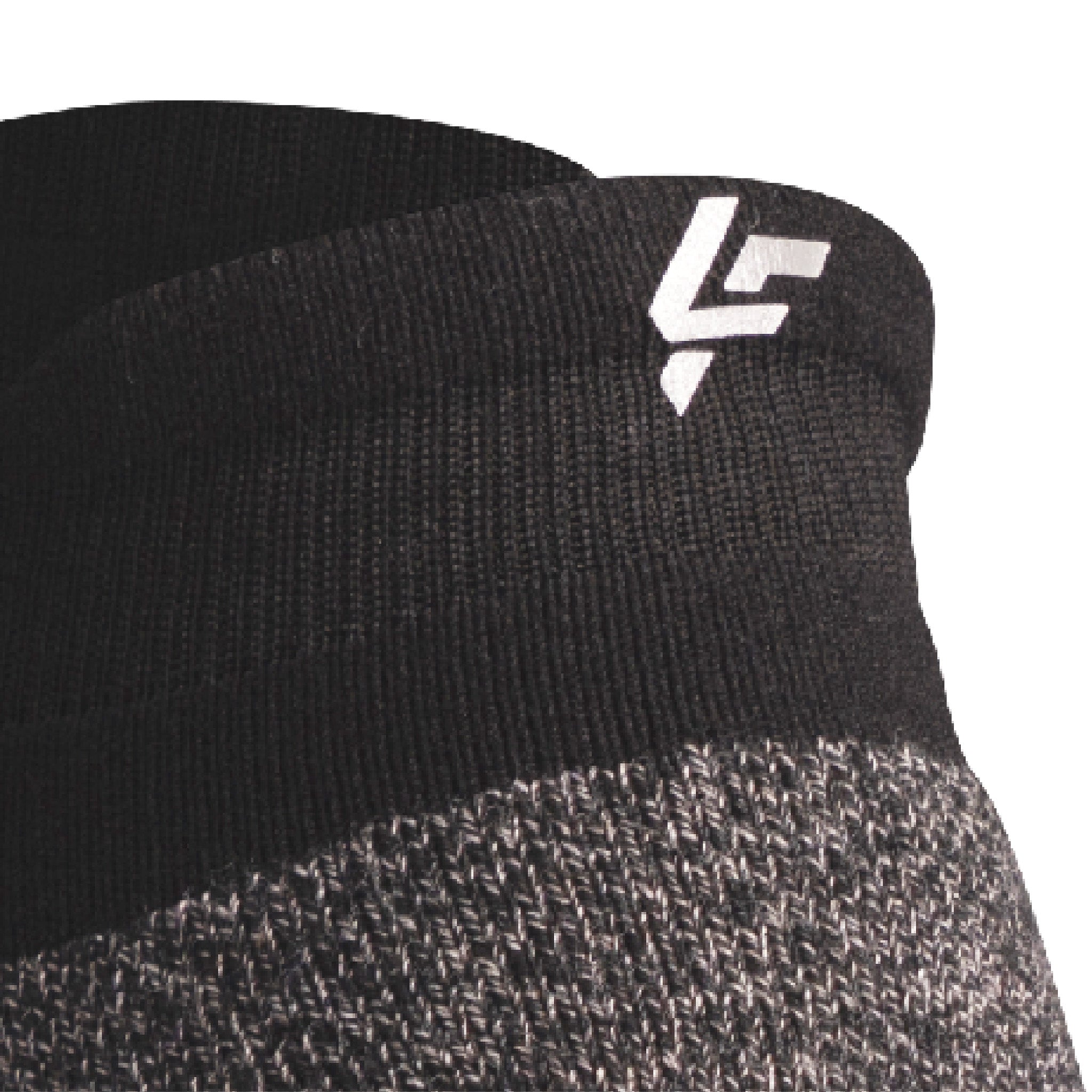 Close up view of reflective symbol on Lightfeet Performance Black Ankle Sock 