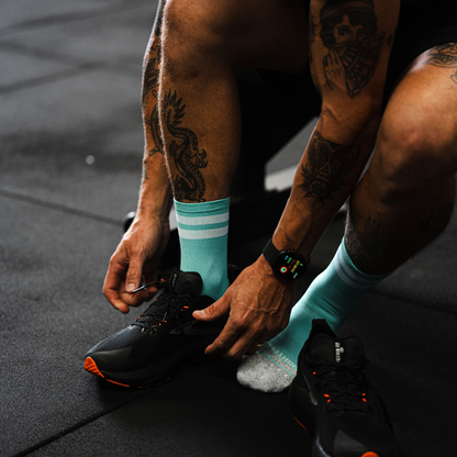 Image of person wearing Lightfeet Performance 2 Stripes Mint Half Crew Socks 
