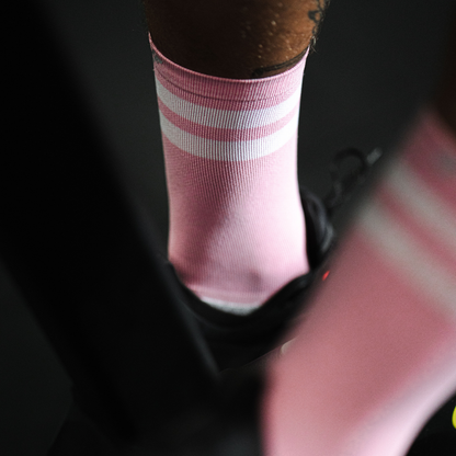 Image of person wearing Lightfeet Performance 2 Stripes Soft Pink Half Crew Socks 