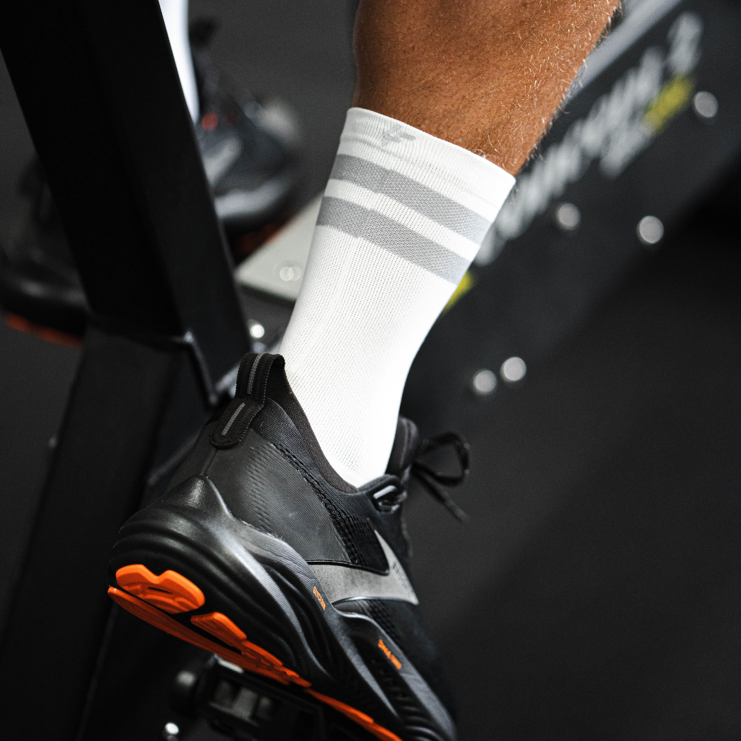 Image of person wearing Lightfeet Performance 2 Stripes White Half Crew Socks 