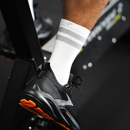 Image of person wearing Lightfeet Performance 2 Stripes White Half Crew Socks 
