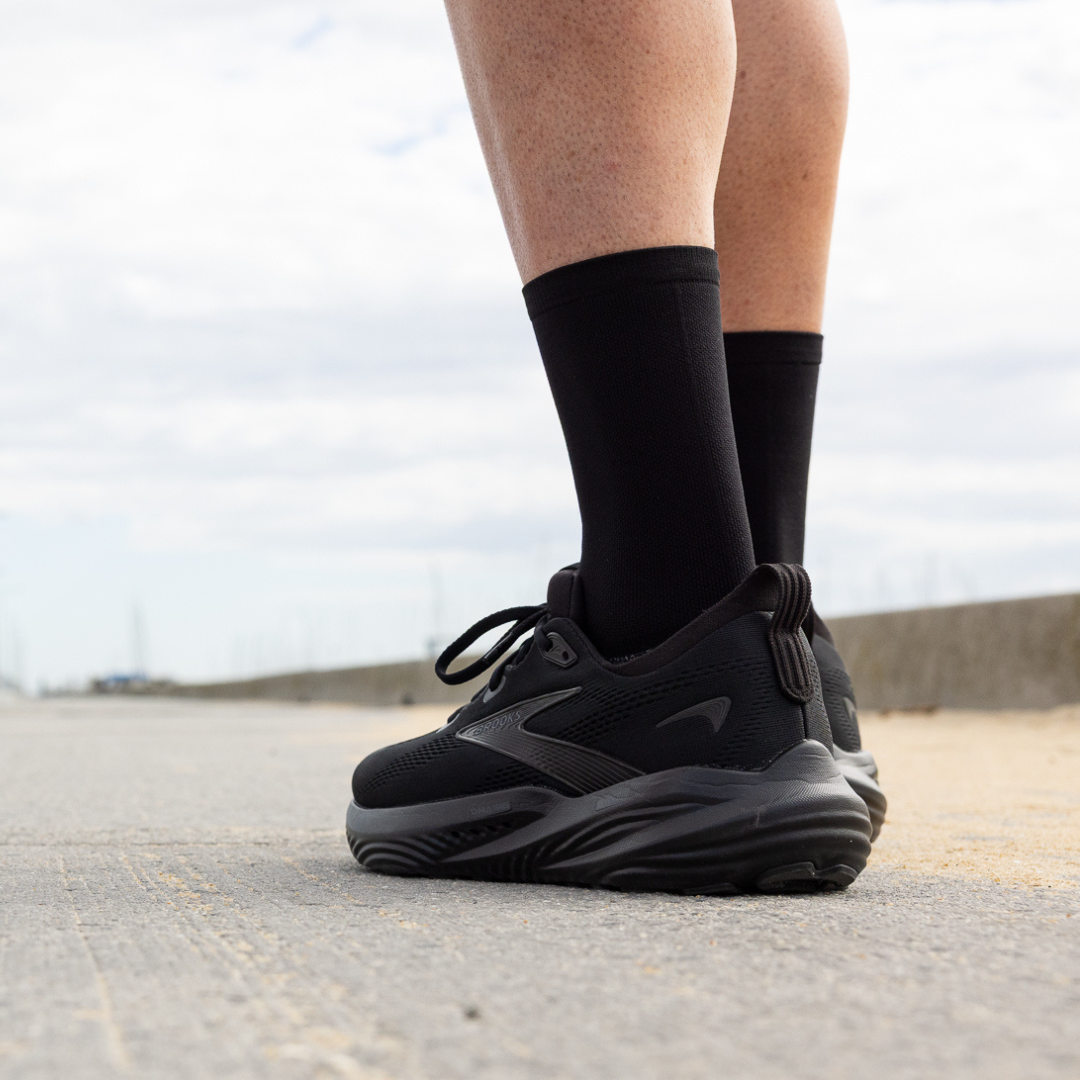 Person wearing Lightfeet Performance Black Half Crew Sock 