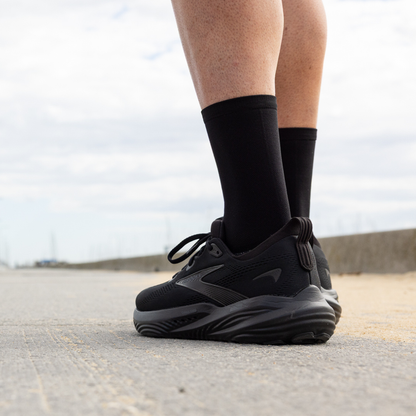 Person wearing Lightfeet Performance Black Half Crew Sock 