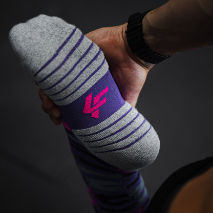 Image of person wearing Lightfeet Performance Predator Purple Aqua Pink Half Crew Socks 