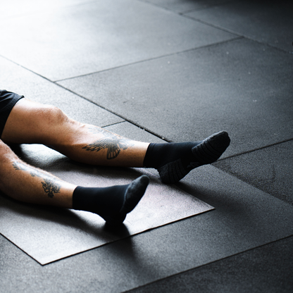 Person wearing Lightfeet Performance Black Quarter Crew Socks 