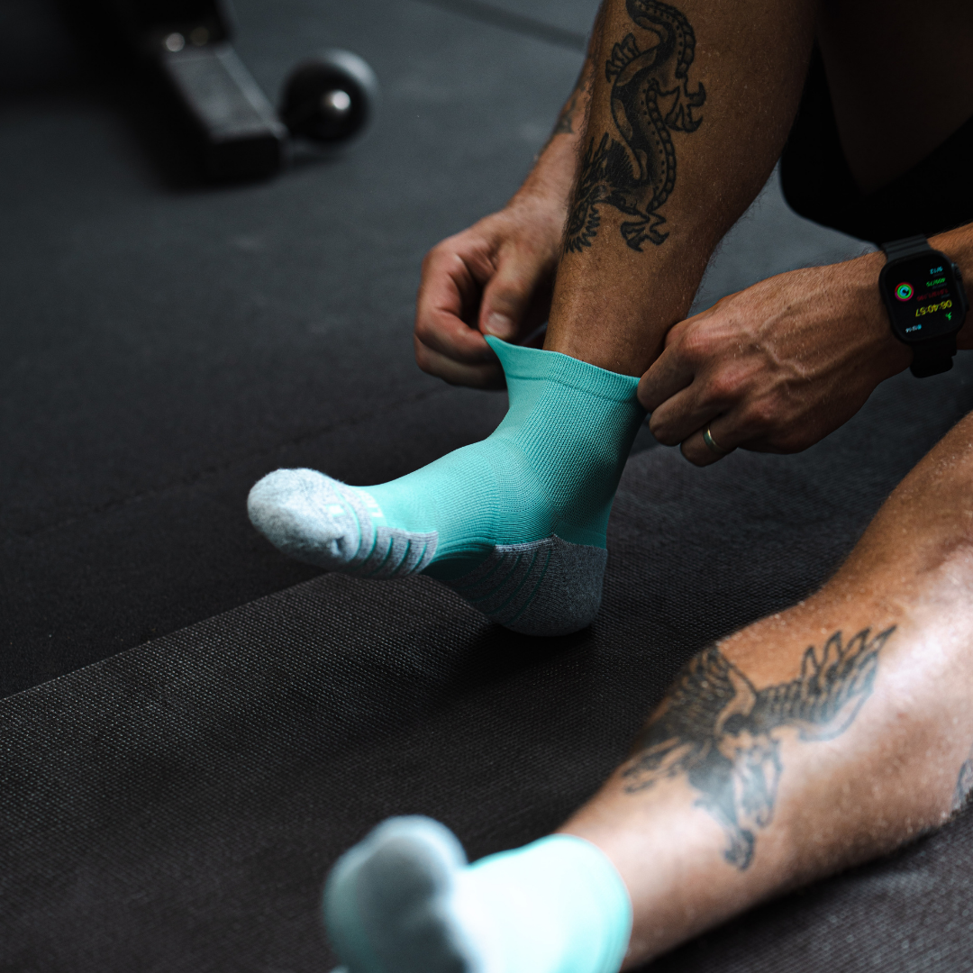 Person wearing Lightfeet Performance Mint Quarter Crew Socks 
