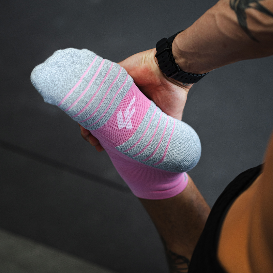 Person wearing Lightfeet Performance Soft Pink Quarter Crew Socks 