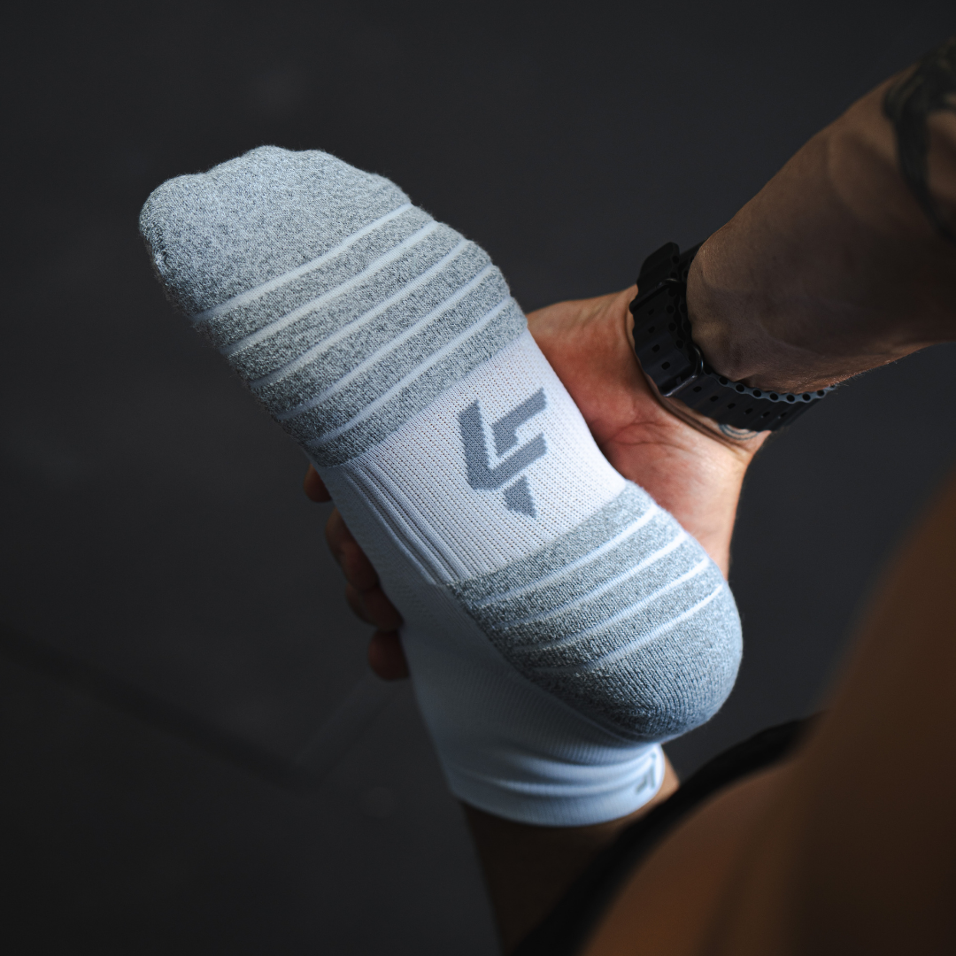 Person wearing Lightfeet Performance White Quarter Crew Socks 