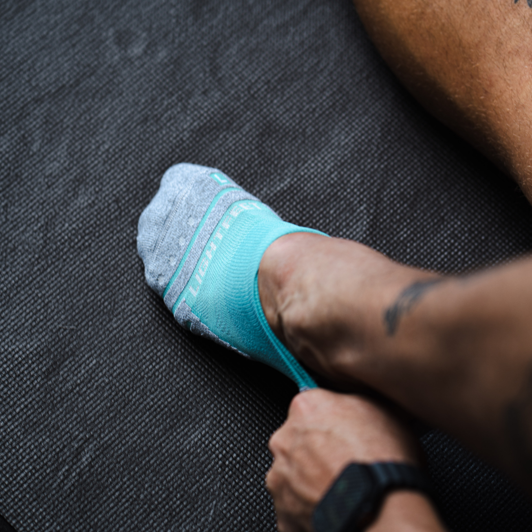 Person wearing Lightfeet Performance Mint Ankle Sock 